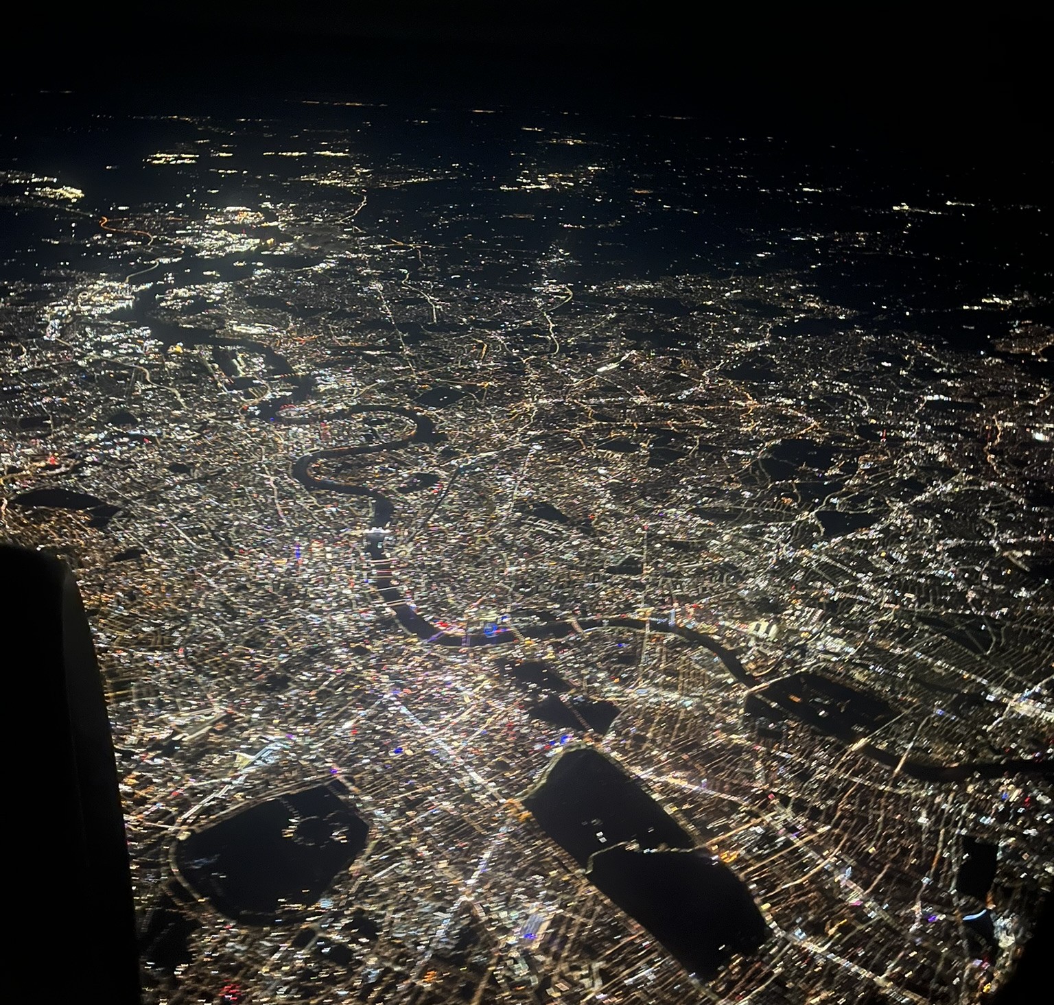 Facing east over London from the air at night